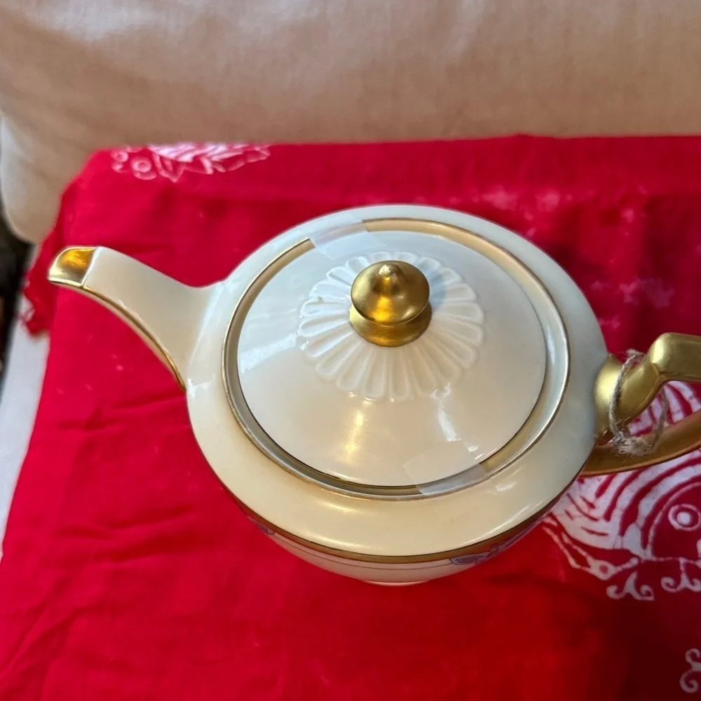 Elegant Gold and Cream Teapot with Blue Accents